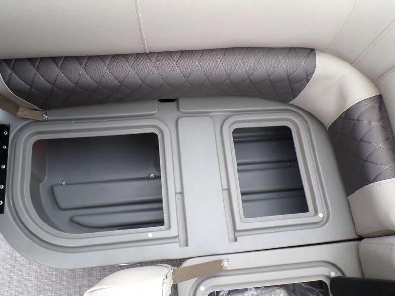 Slide: The Image of 2024 Sun Tracker SportFish™ 22 DLX storage compartments and seating detail. - 24