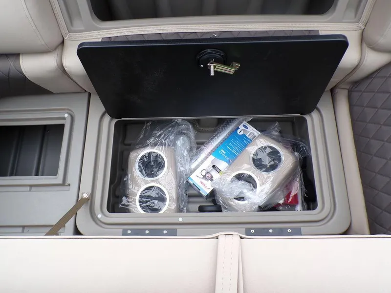Slide: The Image of Storage compartment of 2024 Sun Tracker SportFish™ 22 DLX boat with accessories. - 26