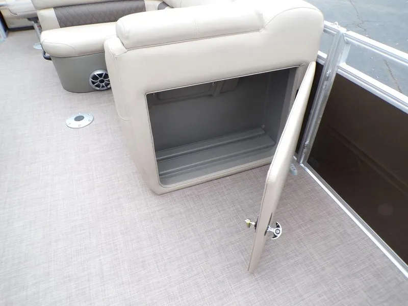 Slide: The Image of 2024 Sun Tracker SportFish™ 22 DLX storage compartment with open door. - 34