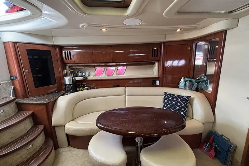 Slide: The Image of Luxurious interior of 2006 Sea Ray 44 Sundancer yacht with elegant seating and wooden finishes. - 19
