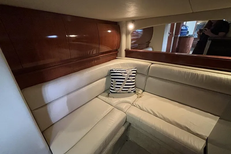 Slide: The Image of Luxurious interior of 2006 Sea Ray 44 Sundancer with cream leather seating and nautical decor. - 21