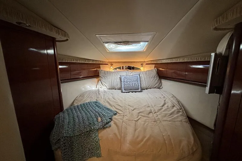 Slide: The Image of Luxurious cabin interior of 2006 Sea Ray 44 Sundancer yacht with cozy bedding. - 23