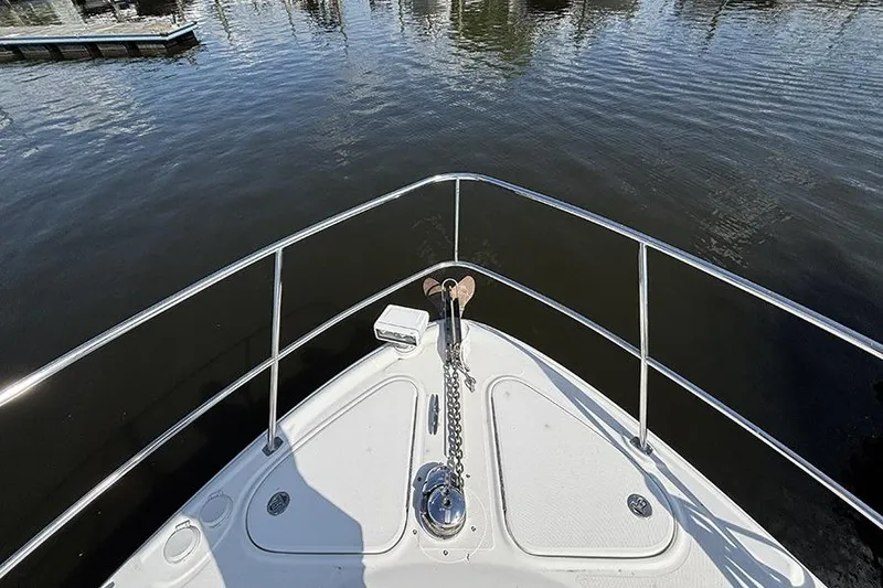 Slide: The Image of Bow view of 2006 Sea Ray 44 Sundancer yacht on calm water. - 30