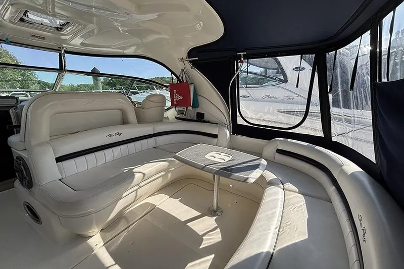 Slide: The Image of Luxurious interior of 2006 Sea Ray 44 Sundancer yacht with white seating and table. - 4