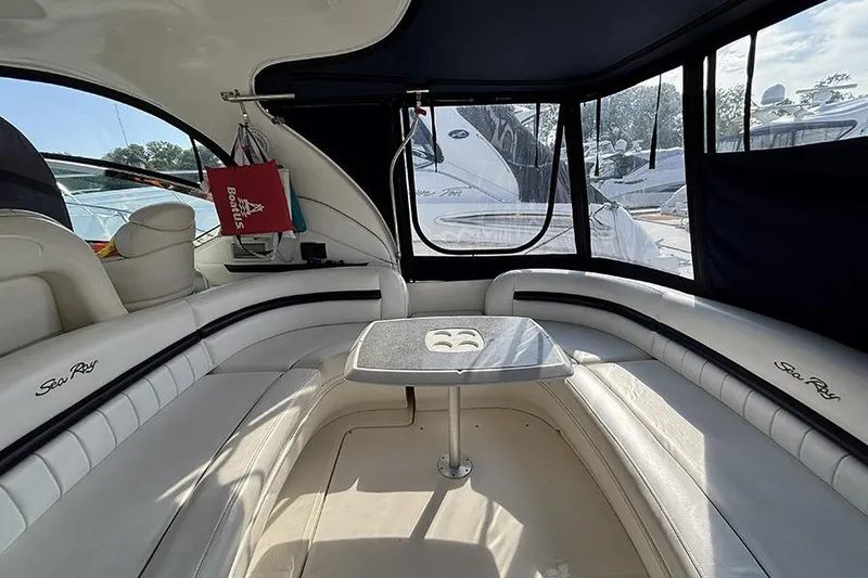 Slide: The Image of Interior of 2006 Sea Ray 44 Sundancer yacht with white seating and table. - 5