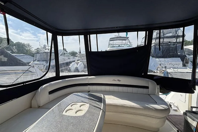 Slide: The Image of Interior view of a 2006 Sea Ray 44 Sundancer yacht with seating and table. - 6