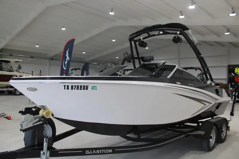 Slide: The Image of 2017 Glastron GT 205 boat on trailer in indoor showroom. - 2