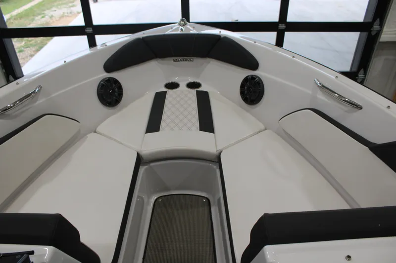 Slide: The Image of 2017 Glastron GT 205 boat interior with cushioned seating and built-in speakers. - 3