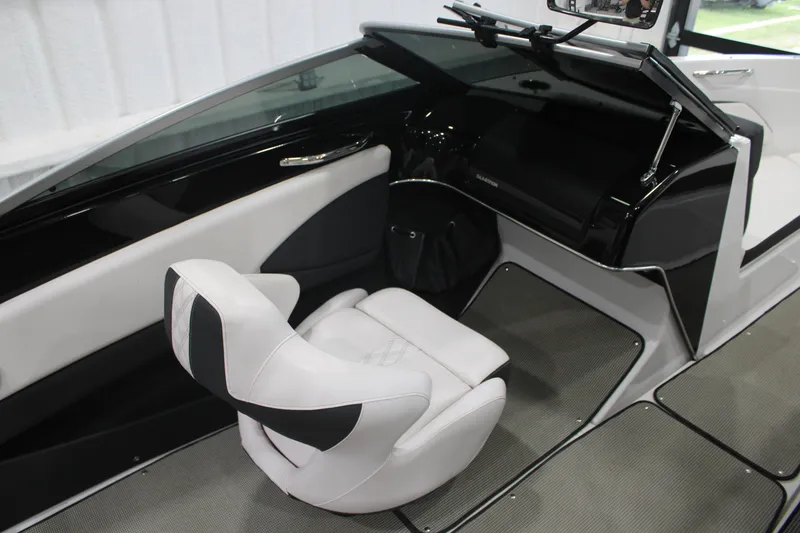 Slide: The Image of 2017 Glastron GT 205 boat interior with sleek black and white seating and modern dashboard. - 4