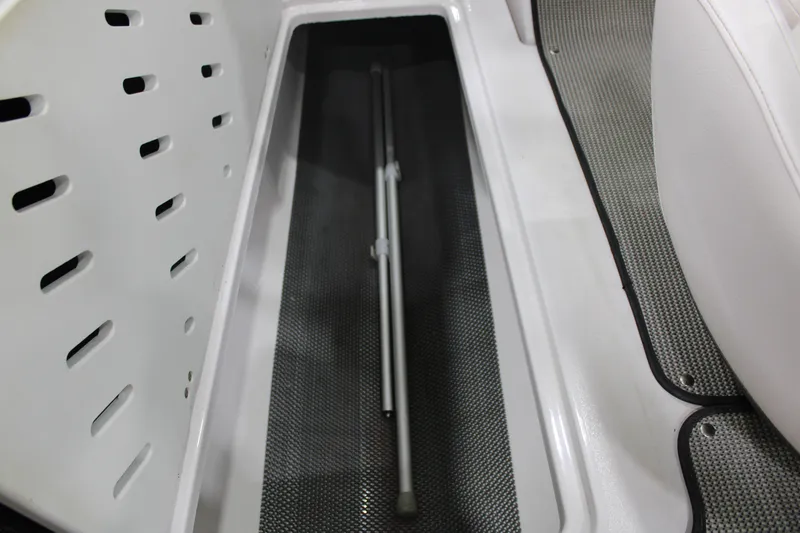 Slide: The Image of Storage compartment in a 2017 Glastron GT 205 boat, featuring sleek interior design. - 5