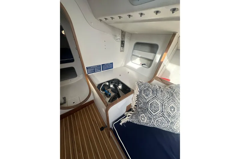 Slide: The Image of Interior of 1998 J Boats J/105 sailboat with sink and patterned cushion. - 10
