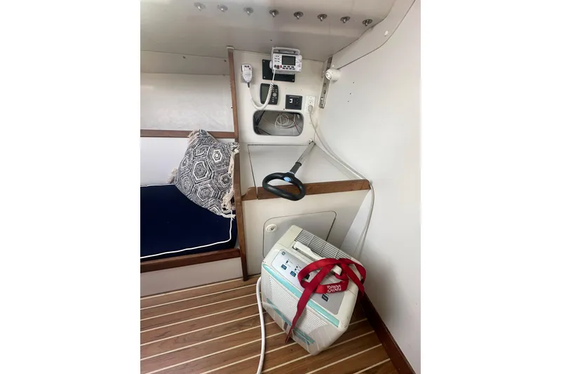 Slide: The Image of Interior of a 1998 J Boats J/105 sailboat with navigation equipment and seating area. - 11