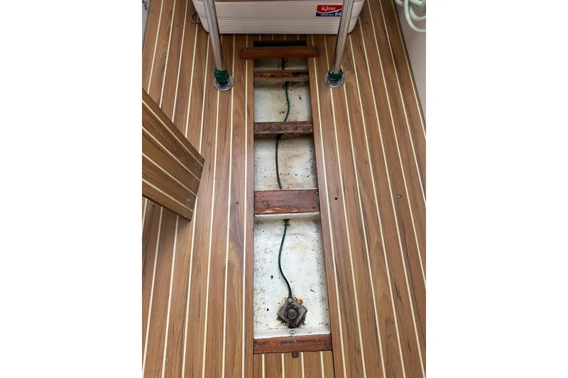 Slide: The Image of 1998 J Boats J/105 interior with wooden flooring and exposed wiring. - 17