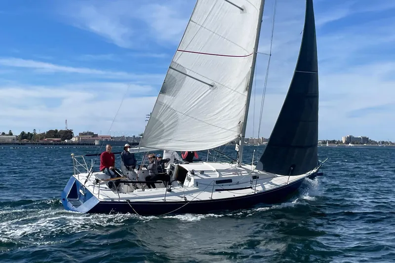 Slide: The Image of Sailing on a 1998 J Boats J/105, crew enjoying a sunny day on the water. - 2