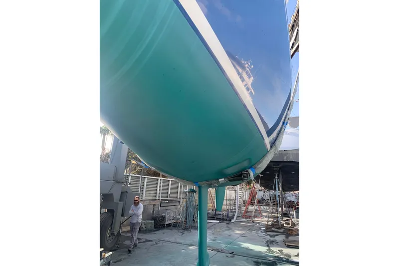 Slide: The Image of 1998 J Boats J/105 sailboat in dry dock, showcasing its sleek hull design. - 20