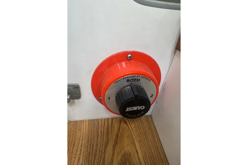 Slide: The Image of Battery selector switch on a 1998 J Boats J/105 sailboat, featuring "Guest" branding. - 22