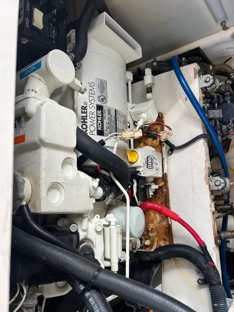 Slide: The Image of Engine compartment of a 2005 Sea Ray 280 Sundancer boat, featuring Kohler power systems. - 35