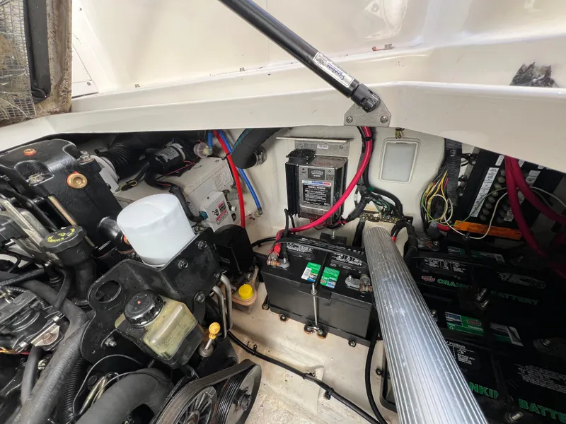 Slide: The Image of Engine compartment of a 2005 Sea Ray 280 Sundancer, showing batteries and wiring. - 36