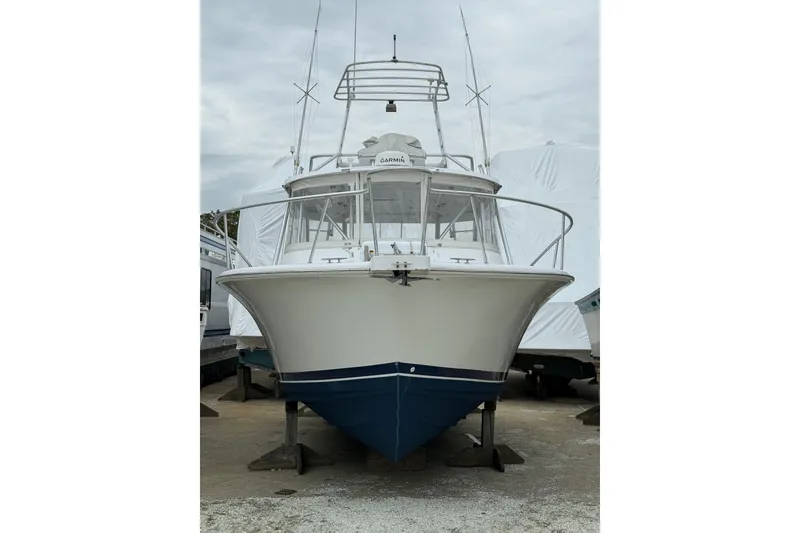 Slide: The Image of 1999 Luhrs Tournament 320 Open boat on dry dock, front view. - 12