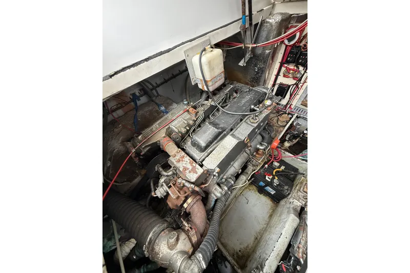 Slide: The Image of Engine compartment of a 1999 Luhrs Tournament 320 Open boat, showing mechanical components. - 15