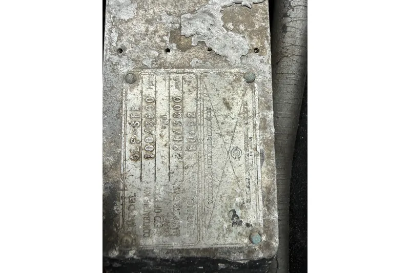 Slide: The Image of Weathered metal identification plate on a 1999 Luhrs Tournament 320 Open boat. - 18
