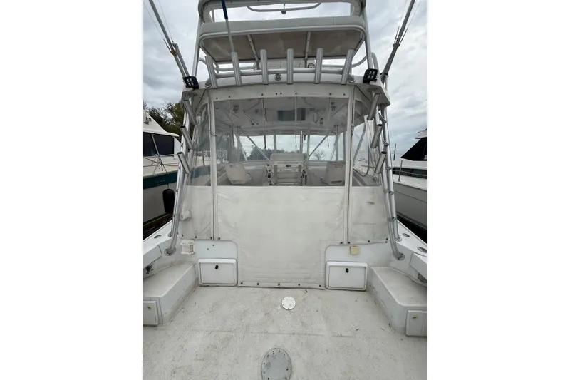 Slide: The Image of 1999 Luhrs Tournament 320 Open boat with enclosed cockpit and ladder. - 19