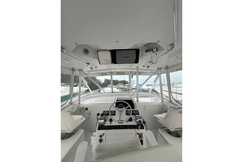 Slide: The Image of 1999 Luhrs Tournament 320 Open boat helm with Garmin navigation system. - 21