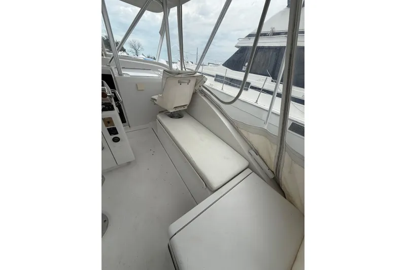 Slide: The Image of 1999 Luhrs Tournament 320 Open boat interior with seating and helm area. - 22