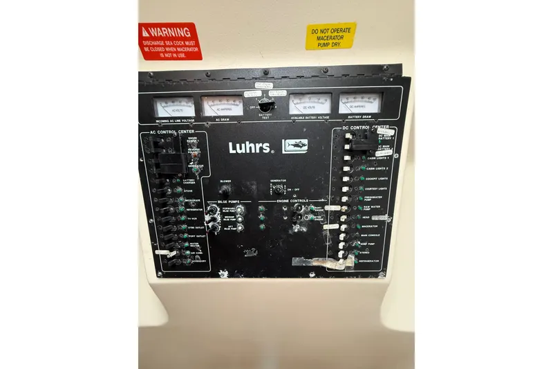 Slide: The Image of Control panel of a 1999 Luhrs Tournament 320 Open boat with warning labels. - 41
