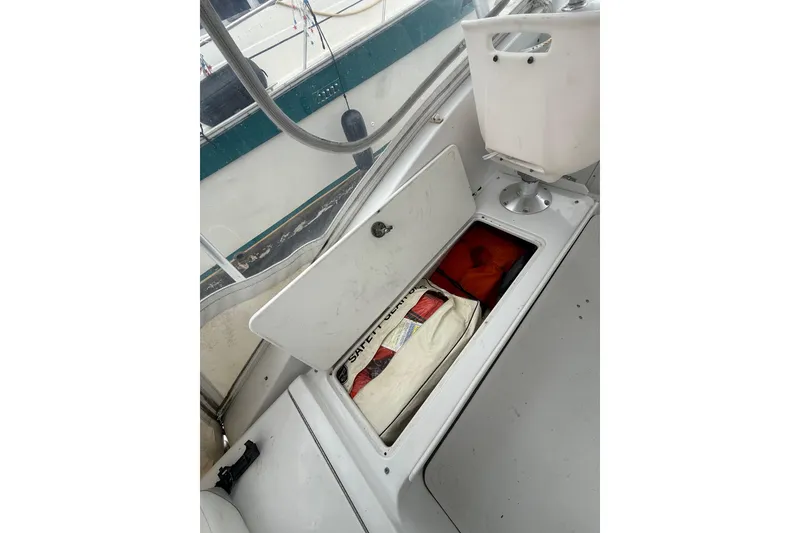 Slide: The Image of Storage compartment on 1999 Luhrs Tournament 320 Open boat with safety gear. - 44