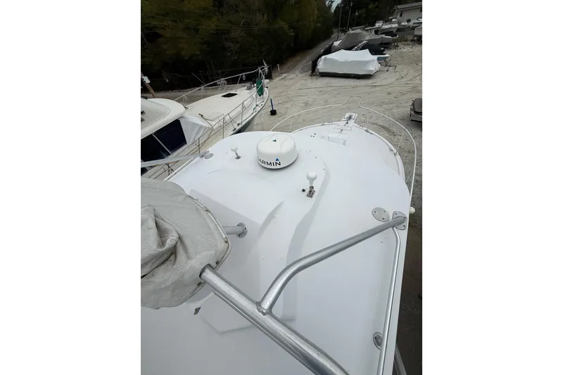 Slide: The Image of 1999 Luhrs Tournament 320 Open boat deck with Garmin equipment, docked on land. - 49