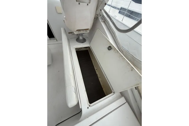 Slide: The Image of Open storage compartment on 1999 Luhrs Tournament 320 Open boat deck. - 50