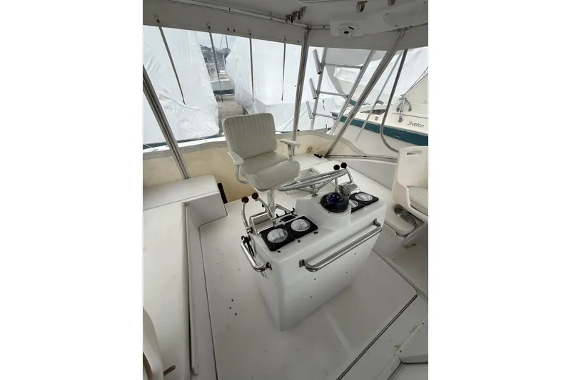Slide: The Image of 1999 Luhrs Tournament 320 Open boat helm with controls and seating. - 52