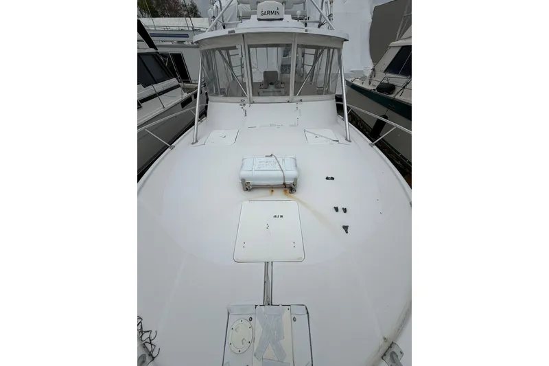Slide: The Image of 1999 Luhrs Tournament 320 Open boat deck, featuring a spacious layout and navigation equipment. - 55