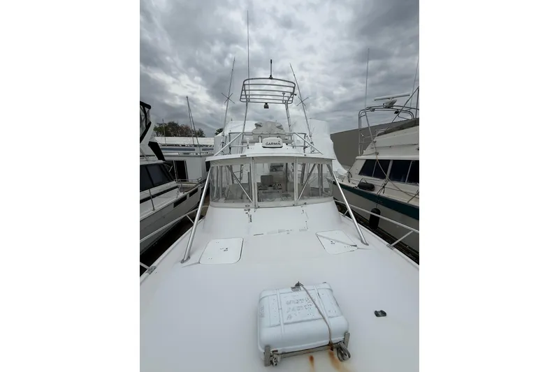 Slide: The Image of 1999 Luhrs Tournament 320 Open boat docked under cloudy skies. - 56