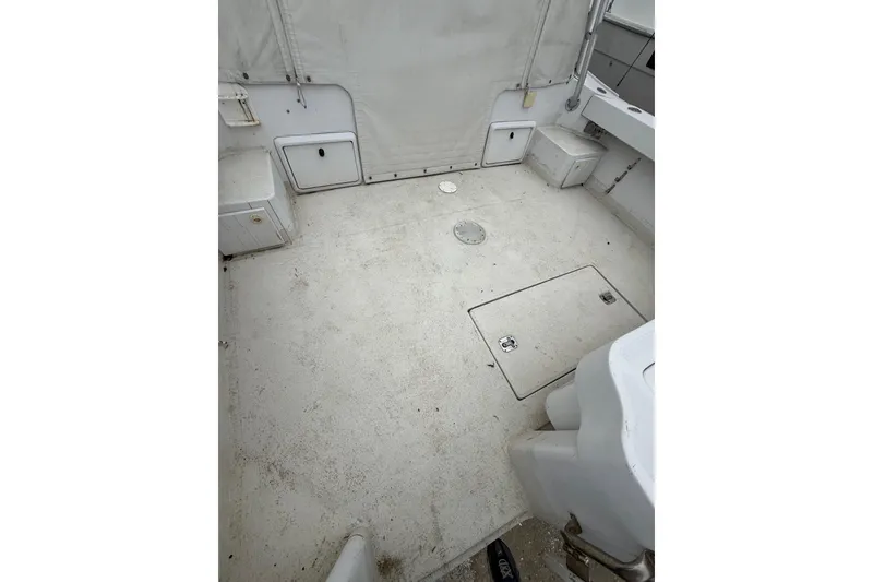 Slide: The Image of 1999 Luhrs Tournament 320 Open boat deck with storage compartments and clean surface. - 62