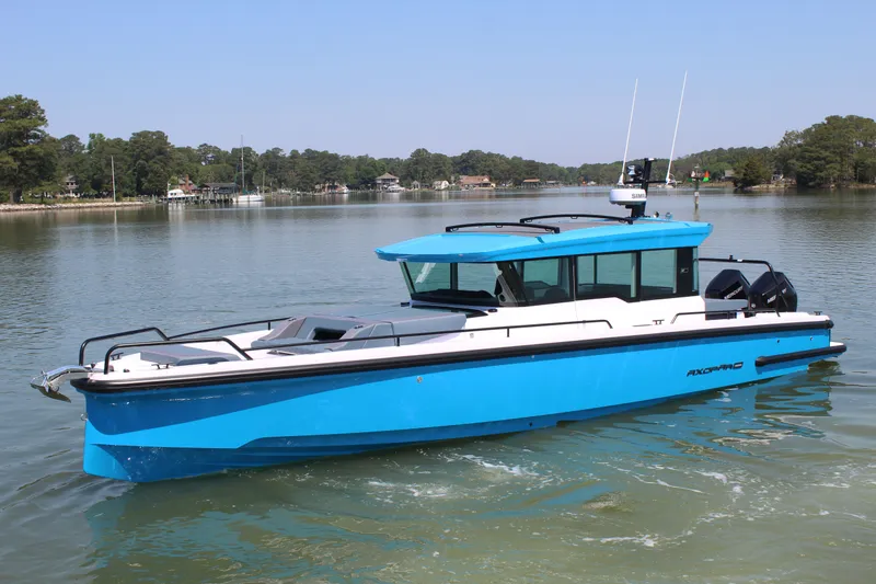 Slide: The Image of 2026 Axopar 37 XC Cross Cabin on calm waters. - 1