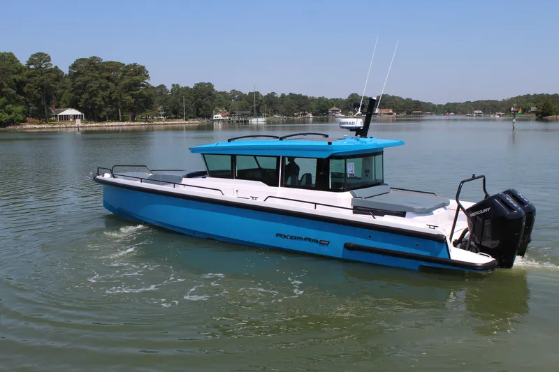 Slide: The Image of Axopar 37 XC Cross Cabin 2026 on calm waters. - 3