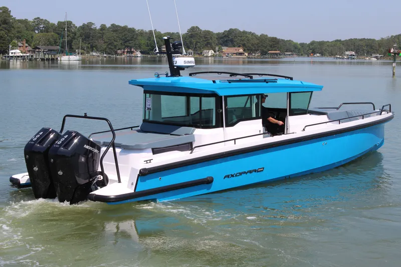 Slide: The Image of Axopar 37 XC Cross Cabin 2026 on calm waters. - 5