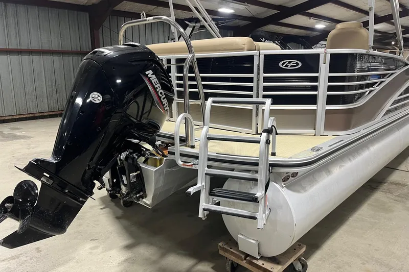 Slide: The Image of 2015 Harris Grand Mariner 250 pontoon boat with Mercury outboard motor in a warehouse. - 3