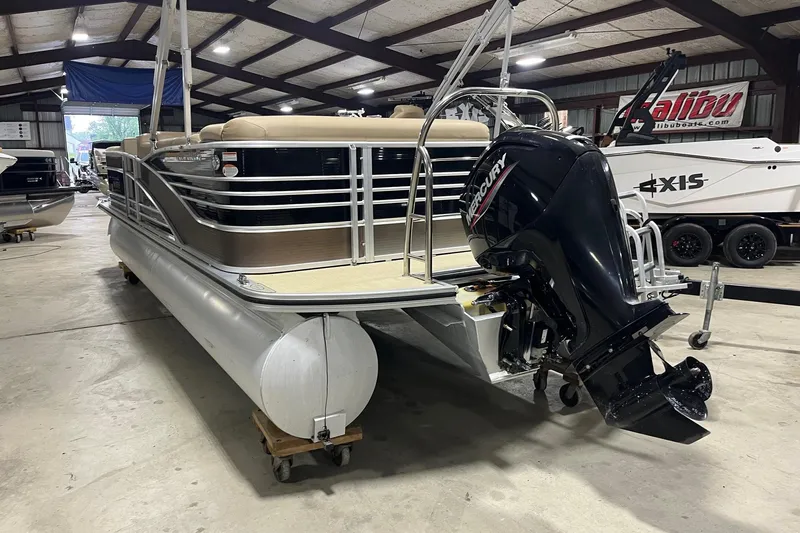 Slide: The Image of 2015 Harris Grand Mariner 250 pontoon boat with Mercury outboard motor in a showroom. - 4