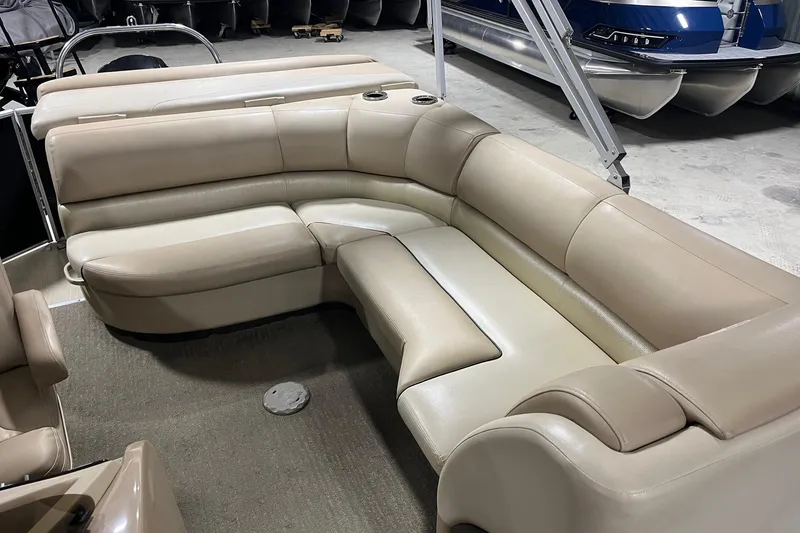 Slide: The Image of 2015 Harris Grand Mariner 250 boat interior with beige leather seating arrangement. - 6