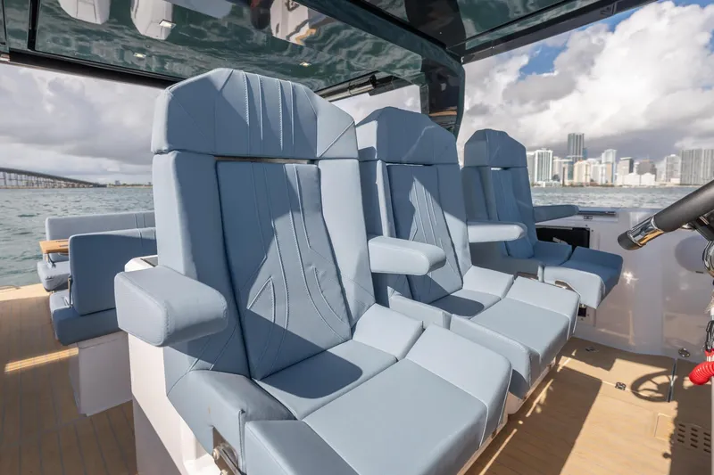 Slide: The Image of Luxurious seating on 2026 Fjord 39 XP yacht, featuring modern design and ocean backdrop. - 10