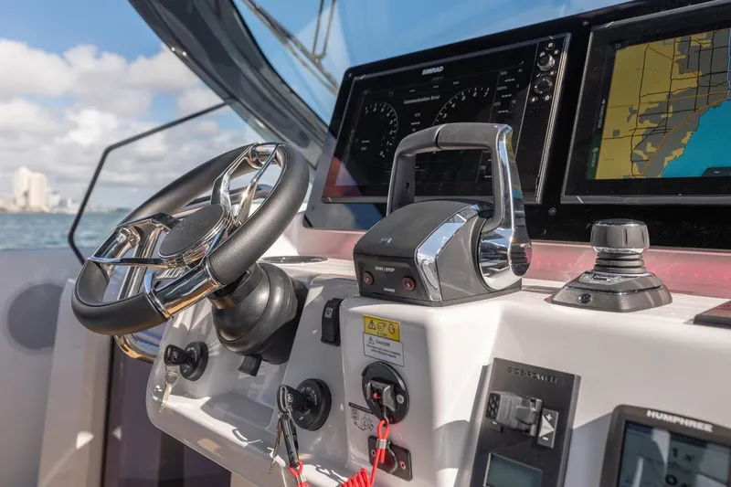 Slide: The Image of Helm of 2026 Fjord 39 XP yacht with advanced navigation systems and controls. - 11