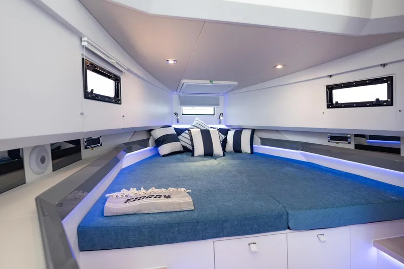 Slide: The Image of Luxurious interior cabin of 2026 Fjord 39 XP yacht with modern bedding and ambient lighting. - 13
