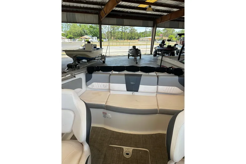 Slide: The Image of Interior view of a 2020 Chaparral 19 SSi boat with cushioned seating. - 8