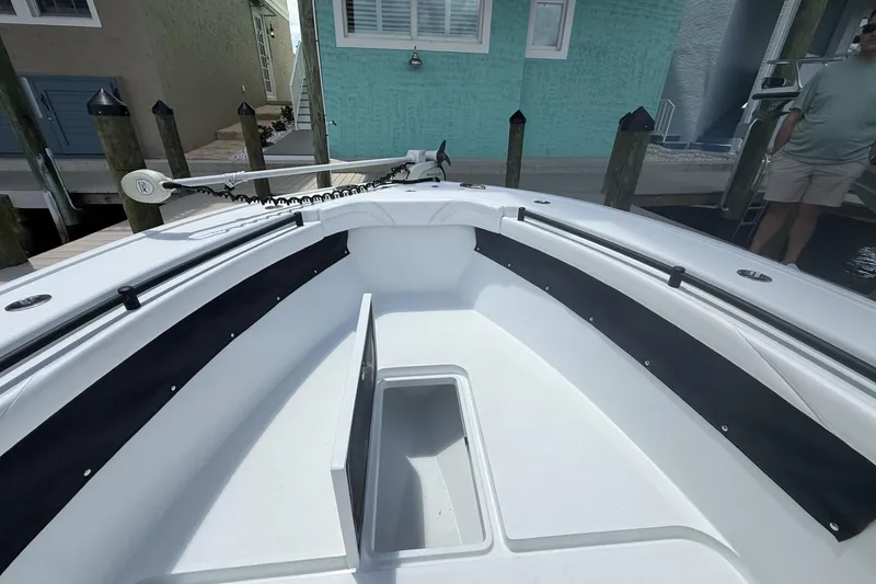 Slide: The Image of 2023 Yellowfin 26 Hybrid boat interior with sleek design and spacious seating. - 14