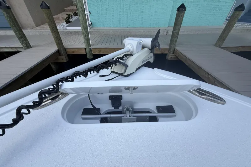 Slide: The Image of 2023 Yellowfin 26 Hybrid boat with MotorGuide trolling motor at dock. - 16