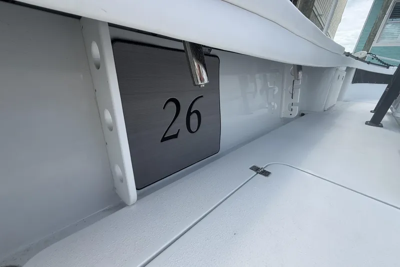 Slide: The Image of 2023 Yellowfin 26 Hybrid boat interior with number 26 displayed. - 24