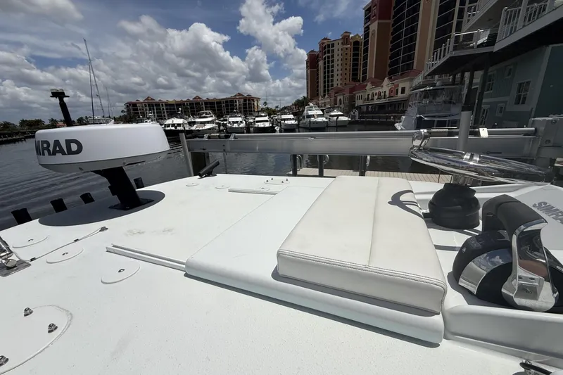 Slide: The Image of 2023 Yellowfin 26 Hybrid boat docked at marina with navigation equipment. - 38